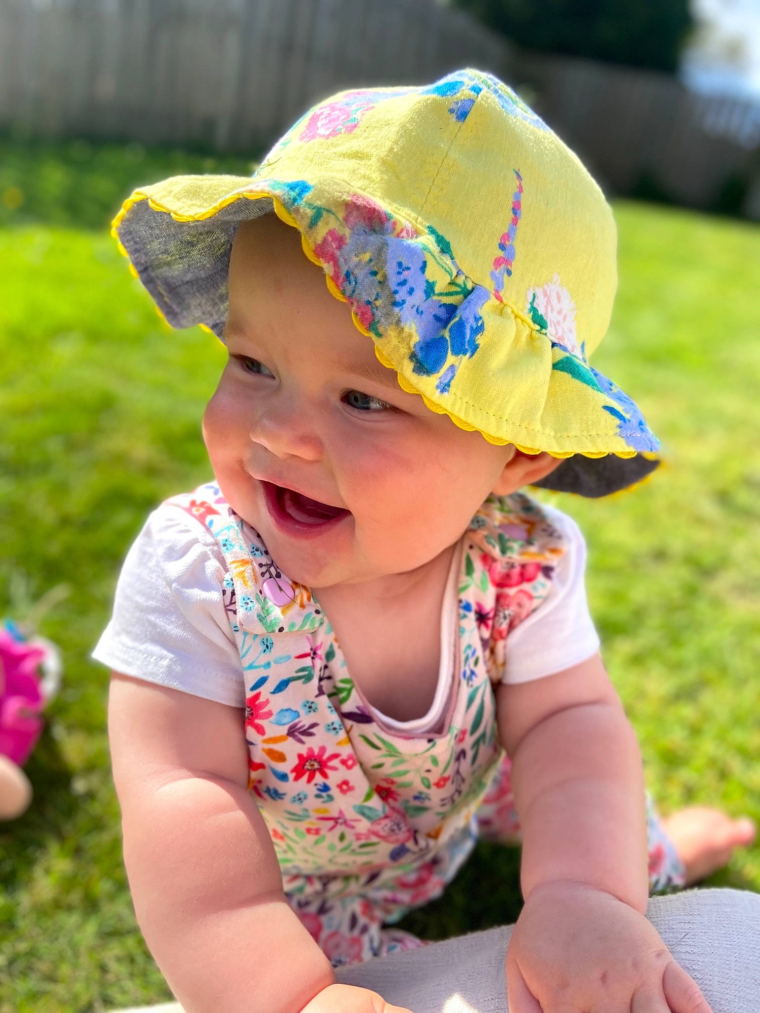 Ayda is registered to the contest to win money with this photo: baby, baby_toddler_clothing, cap, child, costume_hat, fashion_accessory, fun, grass, happy, hat, headwear, leisure, people_in_nature, person, pink, plant, recreation, skin, smile, summer
