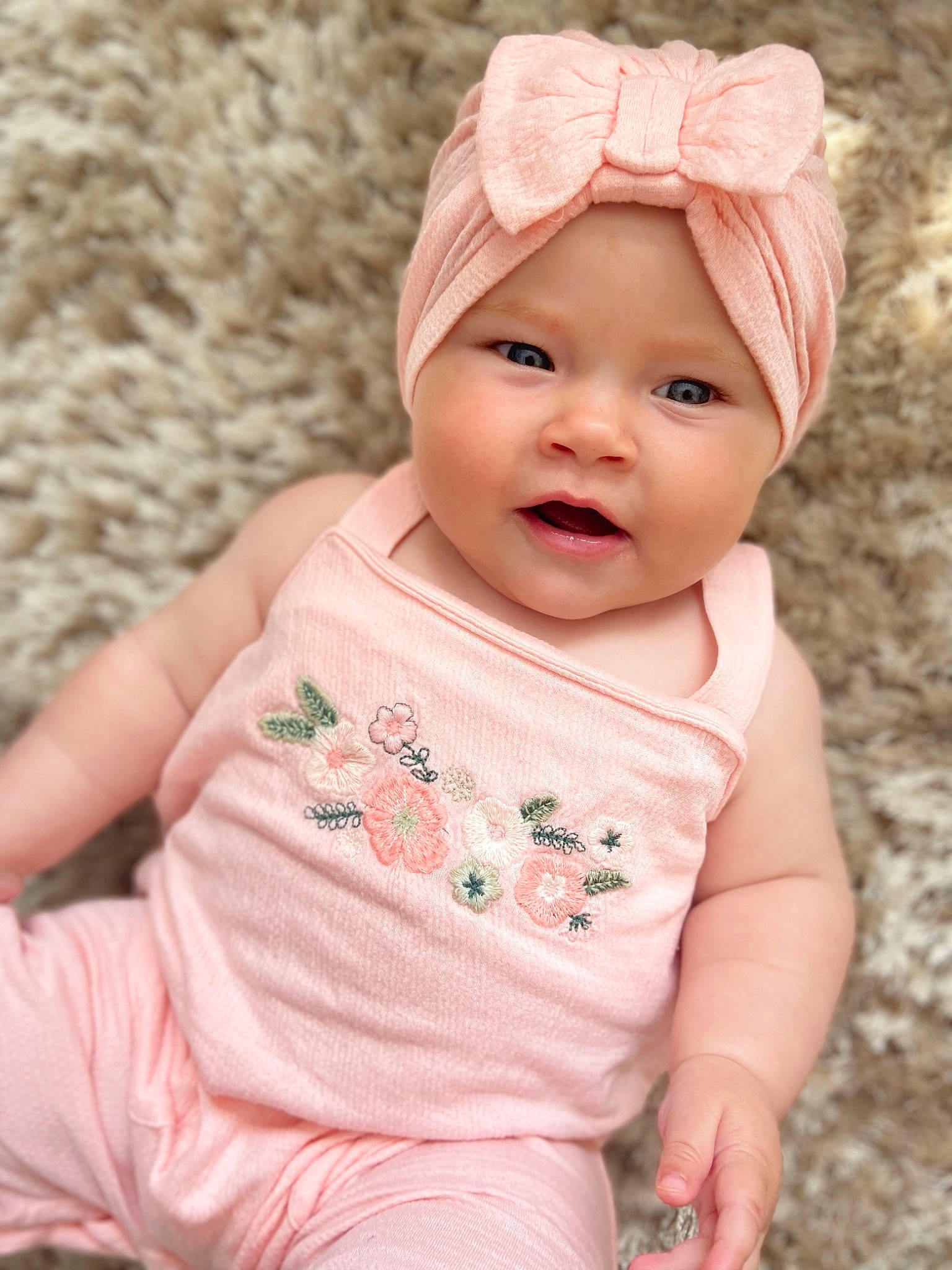 Ayda is registered to the contest to win money with this photo: baby, baby_toddler_clothing, cap, cheek, dress, eye, face, grass, happy, head, headgear, headwear, iris, lip, pattern, person, pink, skin, sleeve, smile