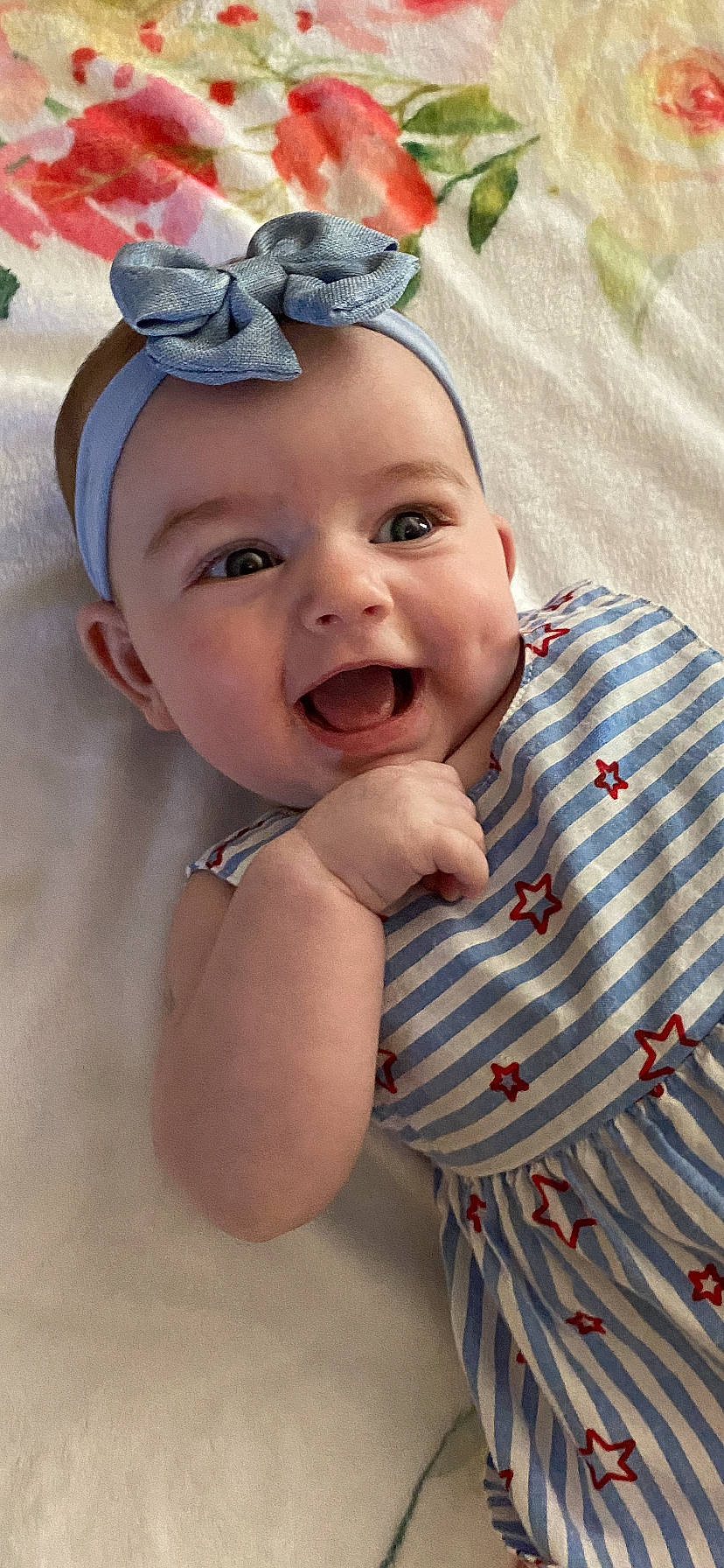 Gracie joined the competition — help win amazing prizes! baby, baby_laughing, baby_toddler_clothing, cap, child, fun, gesture, grass, happy, hat, headband, headpiece, headwear, jewellery, pattern, person, skin, sleeve, smile, textile
