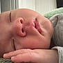 Fabian is registered to the contest to win money with this photo: baby, sleeping, face, hand, closeup, peaceful, infant, skin, soft, blanket, gray_clothing, indoors, resting, young_child, portrait, cute, peace, nap, child, toddler