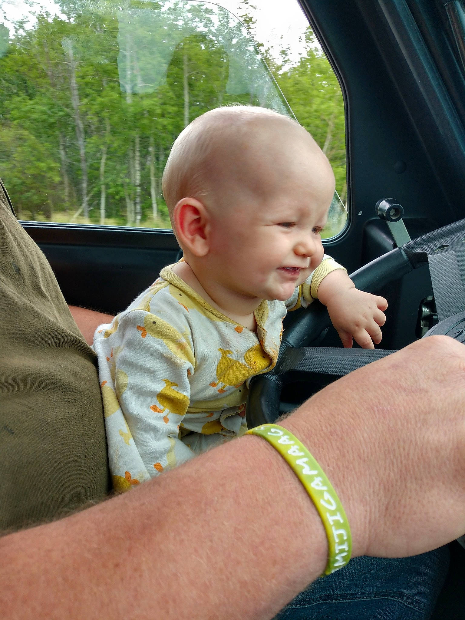 Brock is registered to the contest to win money with this photo: baby, car_seat, child, finger, hand, person, skin, thumb, toddler