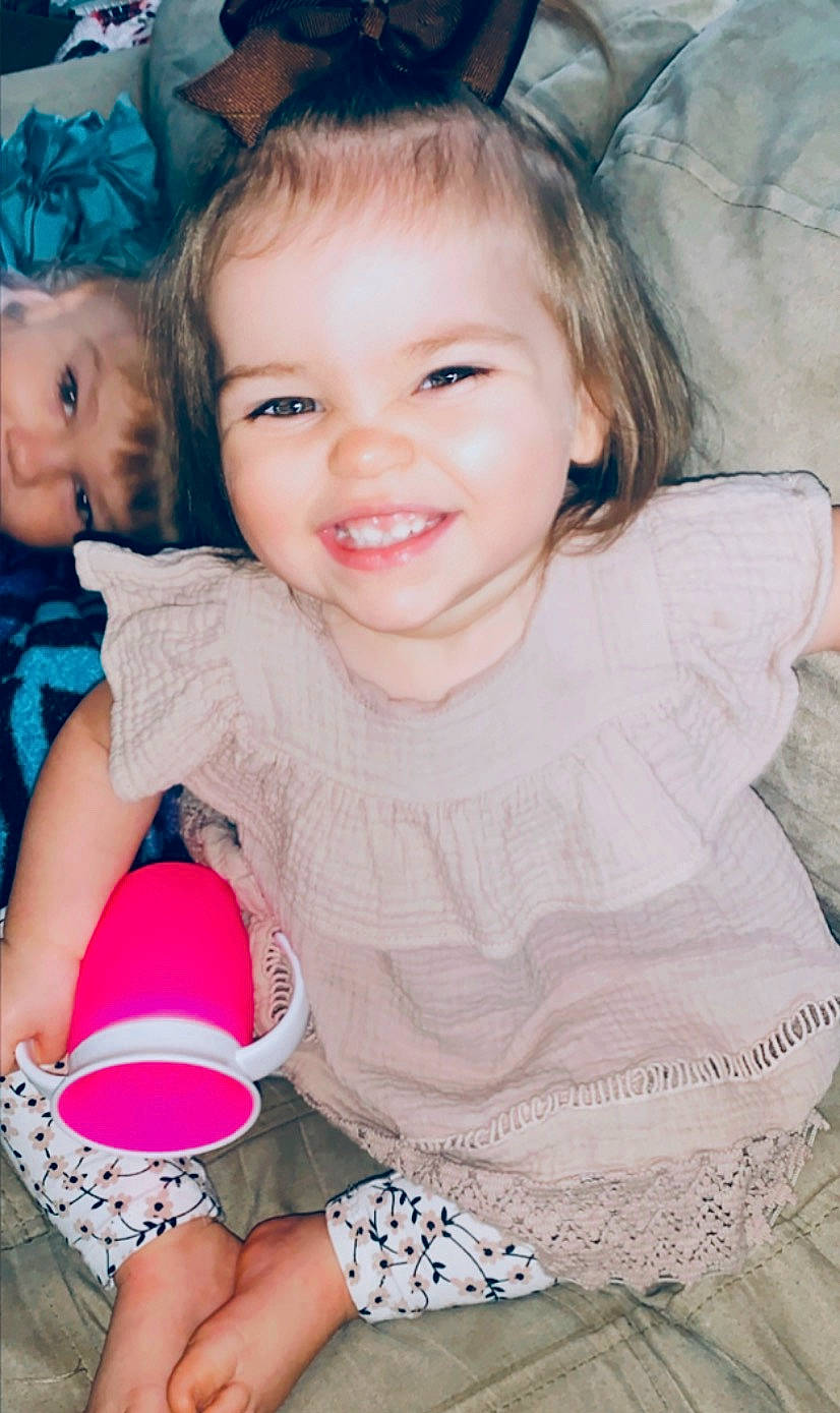 Hailynn is registered to the contest to win money with this photo: baby, baby_toddler_clothing, balloon, child, eye, eyelash, face, hair_accessory, iris, joy, kitchen_utensil, laugh, mouth, nail, nose, person, pink, toddler, tooth