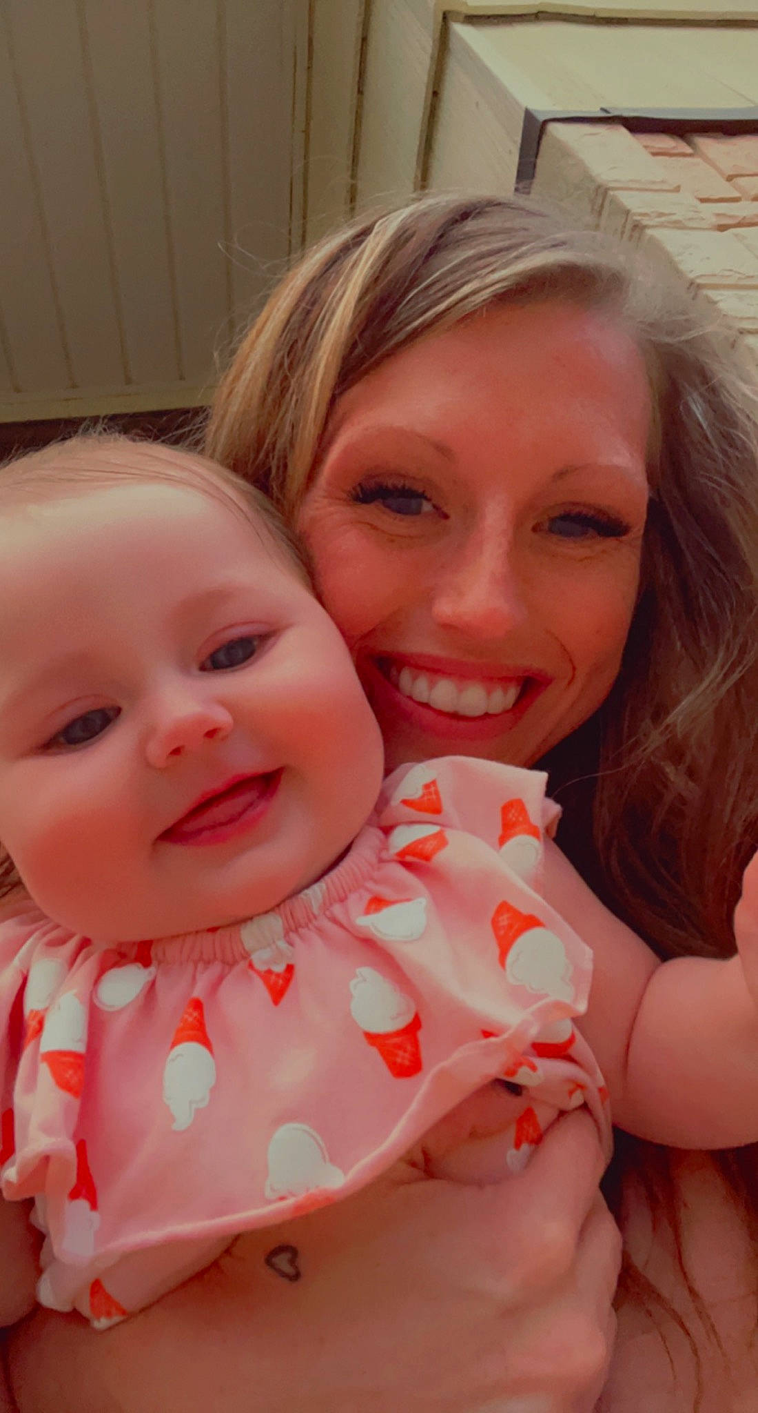 Rylee is registered to the contest to win money with this photo: arm, cheek, dress, eye, face, facial_expression, finger, gesture, hairstyle, hand, happy, head, human_body, iris, joy, lip, mouth, organ, person, plant