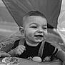 Aaron a rejoint le concours — aidez-le/la à gagner de superbes lots ! baby, infant, smiling, face, dimples, hand, tooth, inflatable, ring, black_and_white, portrait, cute, child, clothing, playful, closeup, happy, young, person, expression