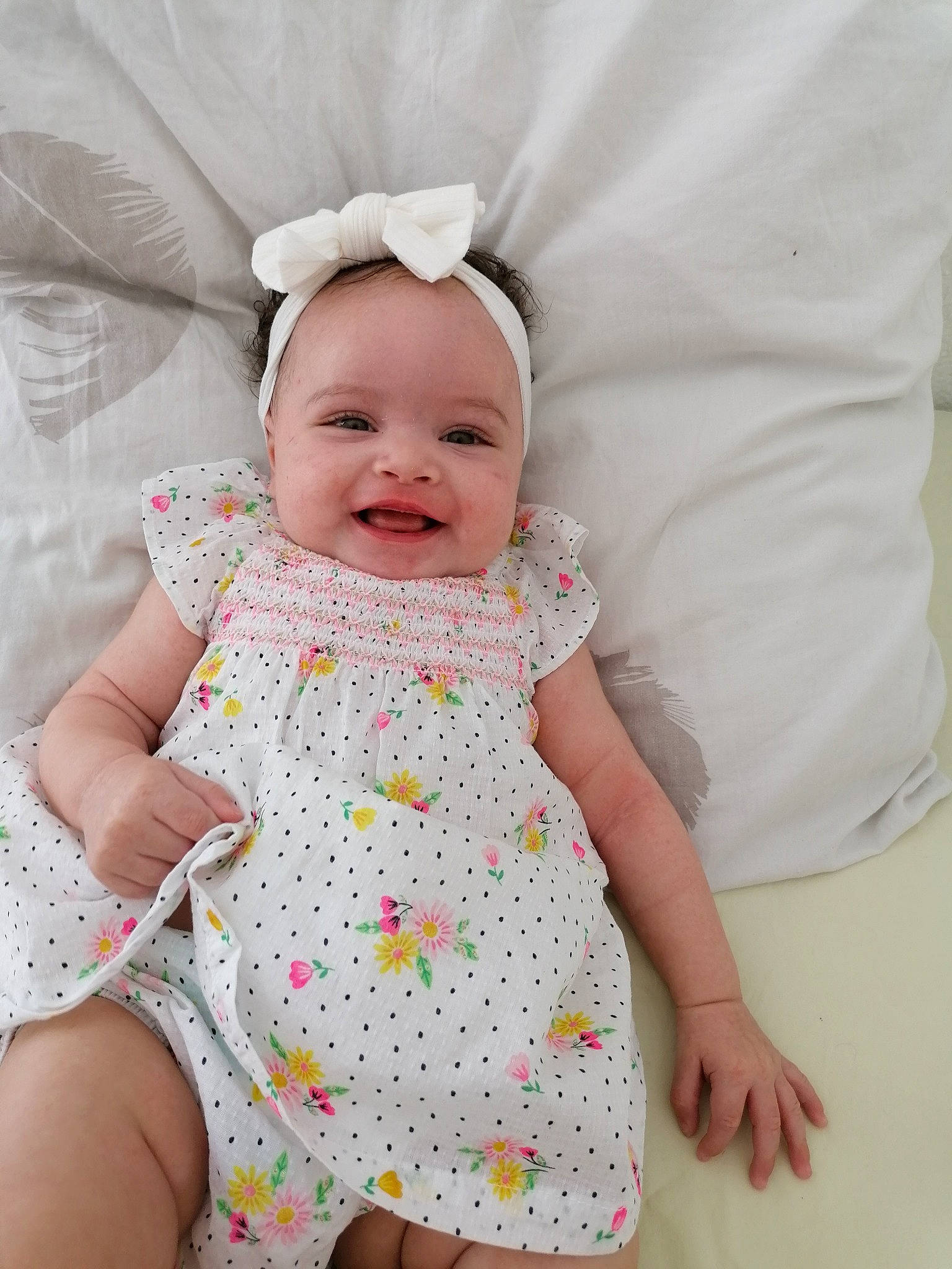 Halima participe au concours pour gagner de l'argent avec cette photo : baby, baby_toddler_clothing, cheek, child, comfort, dress, face, facial_expression, grass, happy, headgear, iris, joy, pattern, person, pink, skin, sleeve, smile, textile