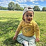 toddler, child, grass, outdoor, smiling, happy, cap, yellow_shirt, pants, socks, nature, trees, clouds, sky, sunny, park, portrait, baby, person, daytime
