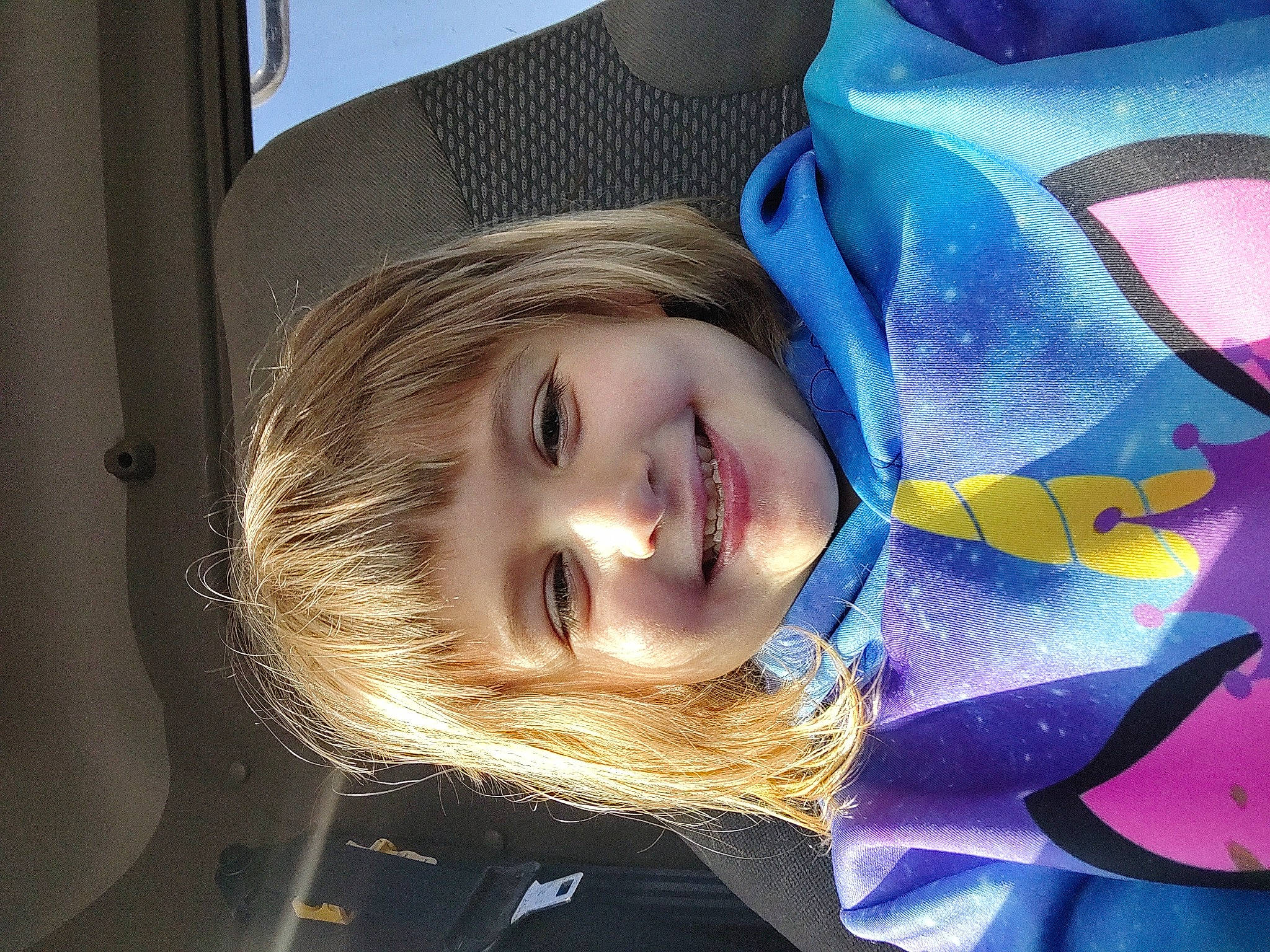 Tatyana is registered to the contest to win money with this photo: automotive_wheel_system, blond, child, electric_blue, eyebrow, eyelash, fashion_accessory, flash_photography, fun, grass, happy, hat, iris, joy, lip, magenta, mouth, pattern, person, portrait_photography