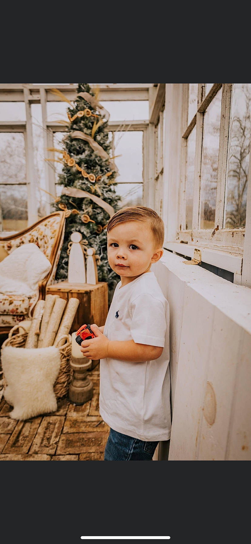 Luke is registered to the contest to win money with this photo: child, christmas, christmas_decoration, christmas_eve, christmas_ornament, christmas_tree, conifer, event, fun, happy, holiday, leisure, ornament, people, person, room, sitting, toddler, tree, winter