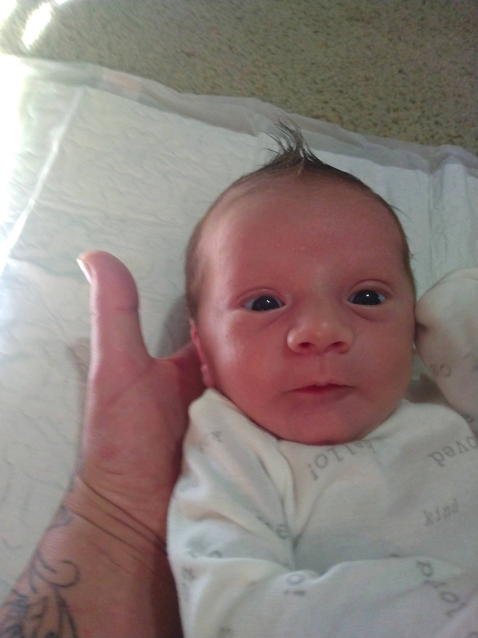 Jonathan is registered to the contest to win money with this photo: baby, baby_toddler_clothing, cheek, child, comfort, elbow, eyebrow, finger, gesture, iris, linens, lip, nose, person, room, skin, sleeve, textile, thumb, toddler