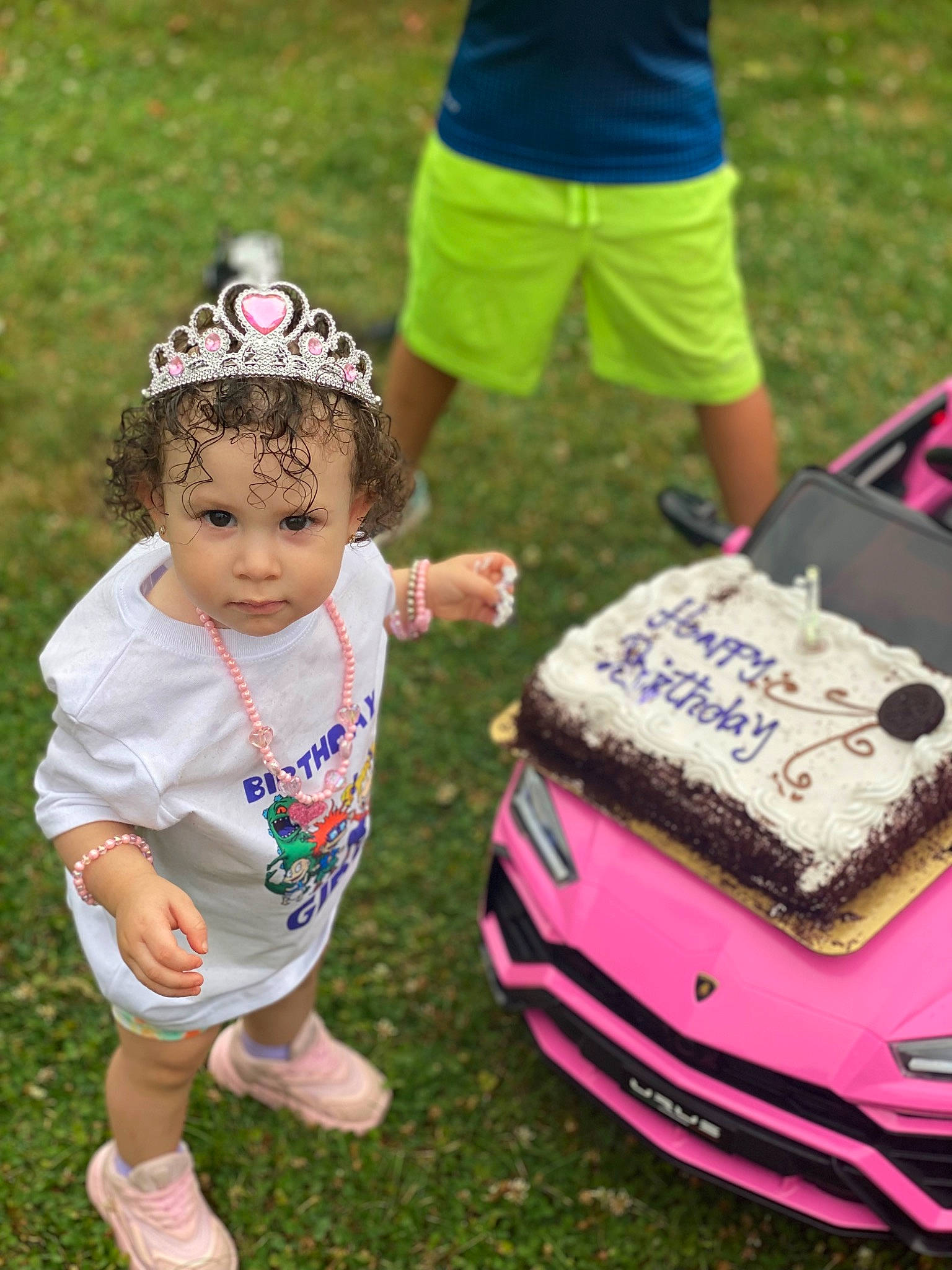 Melani joined the competition — help win amazing prizes! baby_toddler_clothing, baked_goods, bumper, buttercream, cake, cake_decorating, cake_decorating_supply, fun, grass, green, happy, lawn, leisure, motor_vehicle, people, person, recreation, shorts, summer, toddler