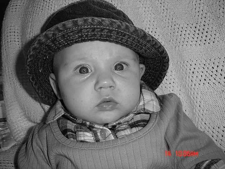 Brookly is registered to the contest to win money with this photo: black, cap, cheek, chin, eye, eyebrow, face, hairstyle, hat, head, headwear, human_body, iris, lip, mouth, nose, person, skin, smile, standing