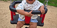Thyam participe au concours pour gagner de l'argent avec cette photo : toddler, child, swing, playground, smiling, sand, grass, tree, outdoor, happy, shorts, shirt, footwear, sandals, person, daylight, park, play, fun, baby
