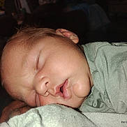 Fredrick joined the competition — help win amazing prizes! baby, child, close_up, cozy, cute, face, green_clothing, head, human, infant, nap, newborn, peace, peaceful, portrait, resting, skin, sleeping, soft_lighting, young