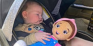 Jasper is registered to the contest to win money with this photo: baby, car_seat, sleeping, doll, toy, child, interior, car, seatbelt, clothing, infant, sunlight, window, face, hand, head, safety, seat, cute, rest