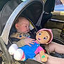 baby, car_seat, sleeping, doll, toy, child, interior, car, seatbelt, clothing, infant, sunlight, window, face, hand, head, safety, seat, cute, rest