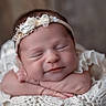newborn, baby, sleeping, headband, smile, closeup, blanket, knitted, soft, peaceful, portrait, infant, cute, resting, hands, face, adorable, cozy, warm, babywear