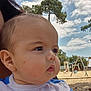 Diégo participe au concours pour gagner de l'argent avec cette photo : baby, child, face, portrait, outdoor, sky, clouds, tree, playground, swing, sand, person, clothing, head, cheeks, daylight, nature, expression, young, casual