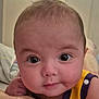 Diégo a rejoint le concours — aidez-le/la à gagner de superbes lots ! baby, close_up, face, eyes, chubby_cheeks, infant, yellow_clothing, purple_clothing, indoor, soft_surface, cute, child, portrait, skin, head, person, young_child, expression, looking_at_camera, adorable
