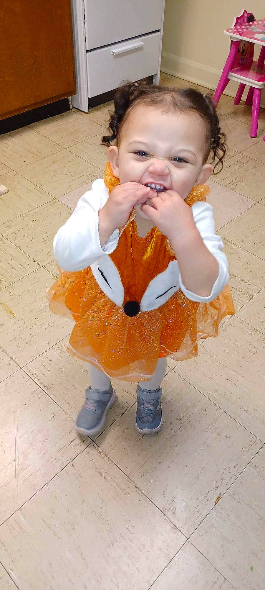 Henley is registered to the contest to win money with this photo: baby, baby_toddler_clothing, cheek, child, event, eye, face, flooring, fun, gesture, hair, hand, happy, head, nose, person, skin, sleeve, smile, thumb