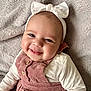 baby, smile, headband, bow, pink_dress, corduroy, buttons, white_shirt, blanket, soft_texture, cute, infant, portrait, happy, child, face, indoors, closeup, person, young