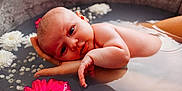 Romy a rejoint le concours — aidez-le/la à gagner de superbes lots ! baby, bath, child, closeup, cute, face, floating, flowers, hand, infant, newborn, peaceful, pink_flower, portrait, relaxing, skin, soft_light, tub, water, white_flower