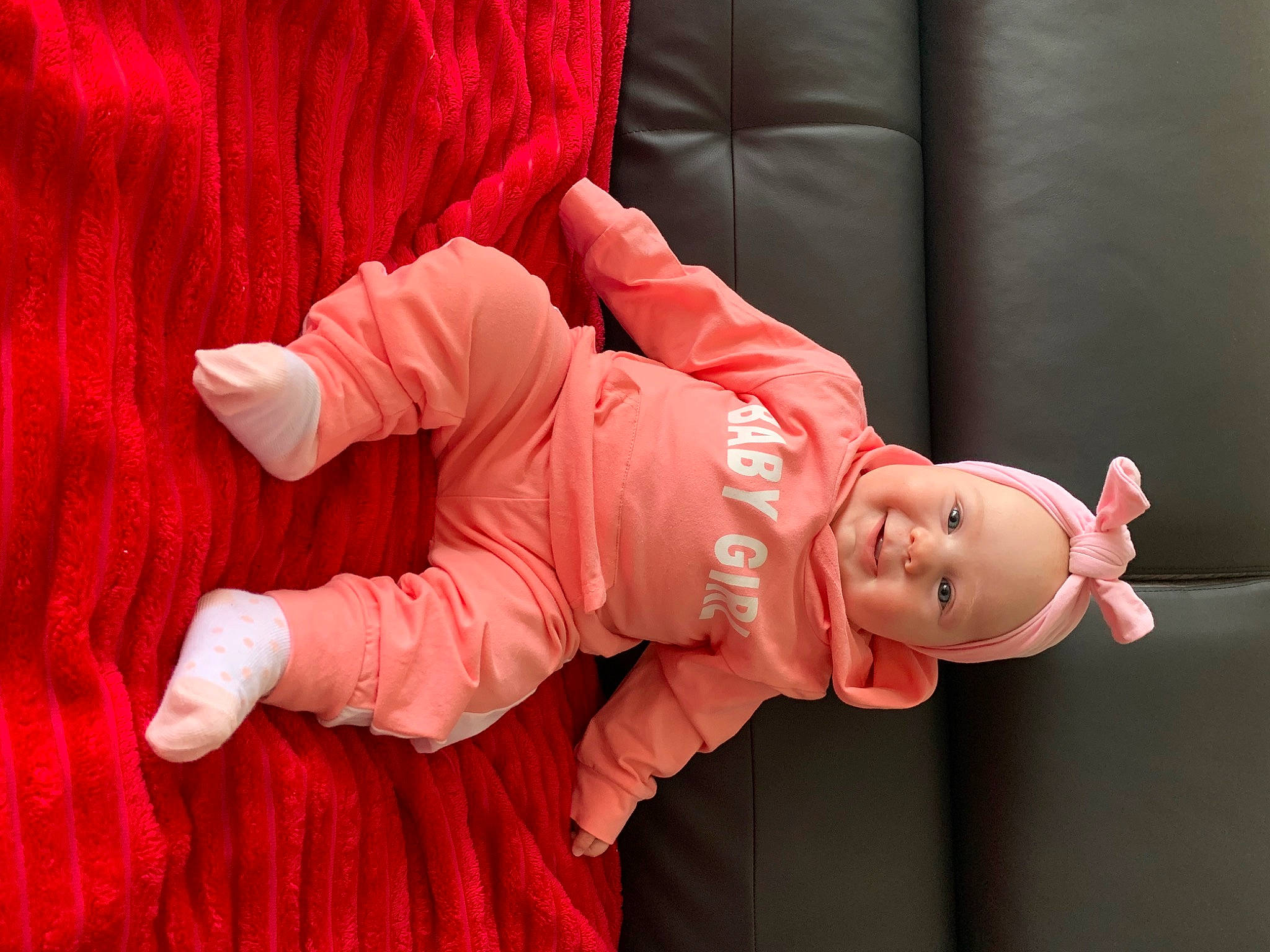 Lenaya participe au concours pour gagner de l'argent avec cette photo : baby, baby_toddler_clothing, carmine, comfort, couch, entertainment, event, happy, hat, headwear, leg, magenta, peach, performance, performing_arts, person, pink, red, sleeve, smile