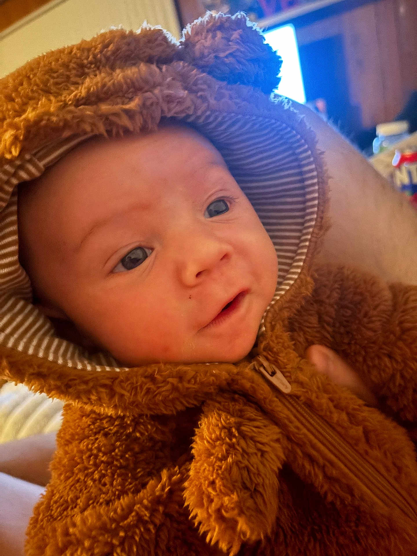 Cole joined the competition — help win amazing prizes! baby, infant, hoodie, fur_clothing, cute, face, portrait, child, warm_clothing, indoor, person, soft_texture, expression, eyes, closeup, young_child, adorable, cuddly, warmth, cozy