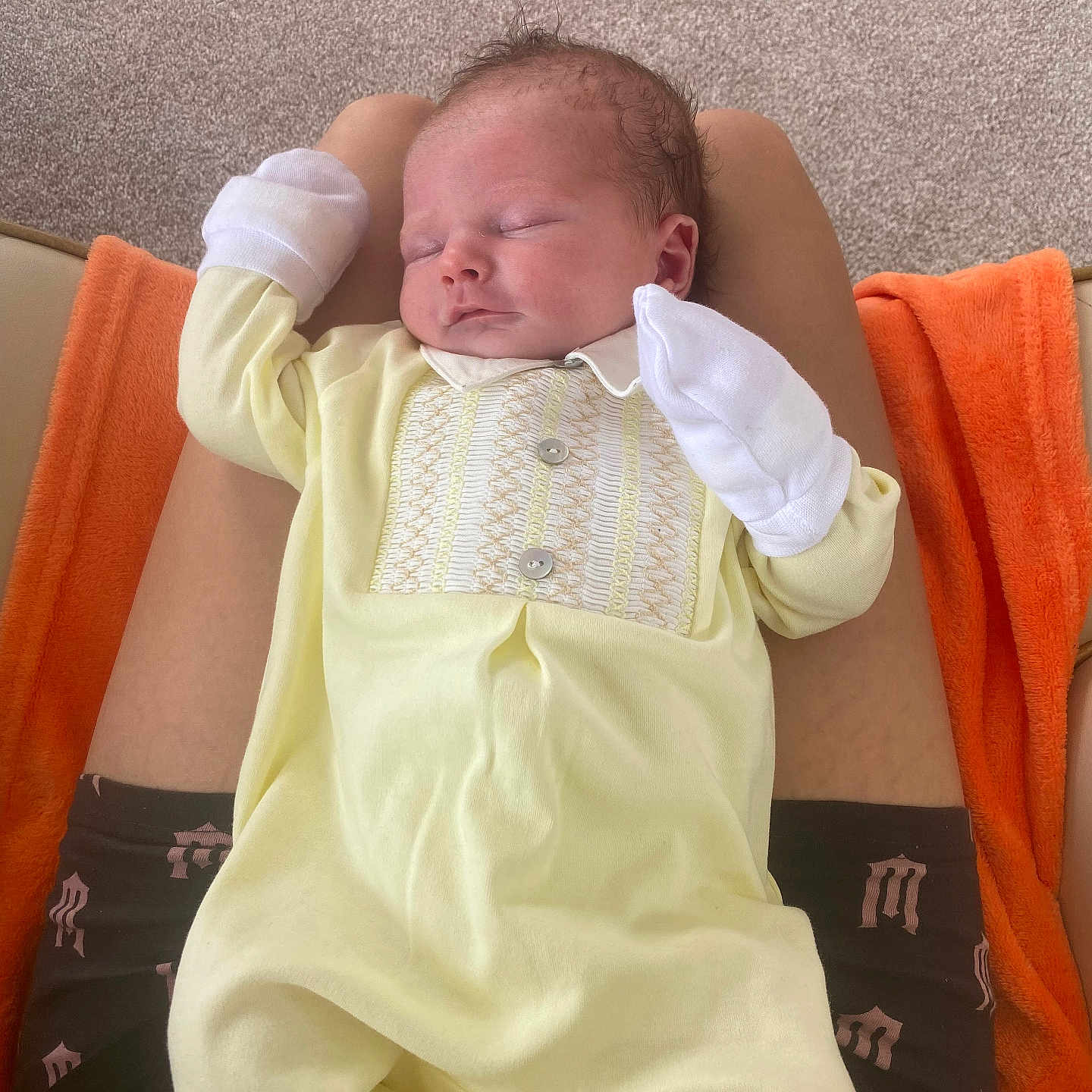 Terry joined the competition — help win amazing prizes! baby, carpet, child, comfort, cute, human, indoor, infant, lap, mittens, newborn, orange_blanket, peaceful, person, portrait, relaxing, resting, sleeping, soft_fabric, yellow_onesie