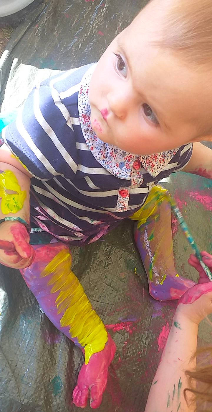 Eleanor participe au concours pour gagner de l'argent avec cette photo : baby, baby_toddler_clothing, child, eyelash, fashion_accessory, fun, grass, happy, magenta, pattern, person, pink, play, sitting, skin, sleeve, toddler, woolen