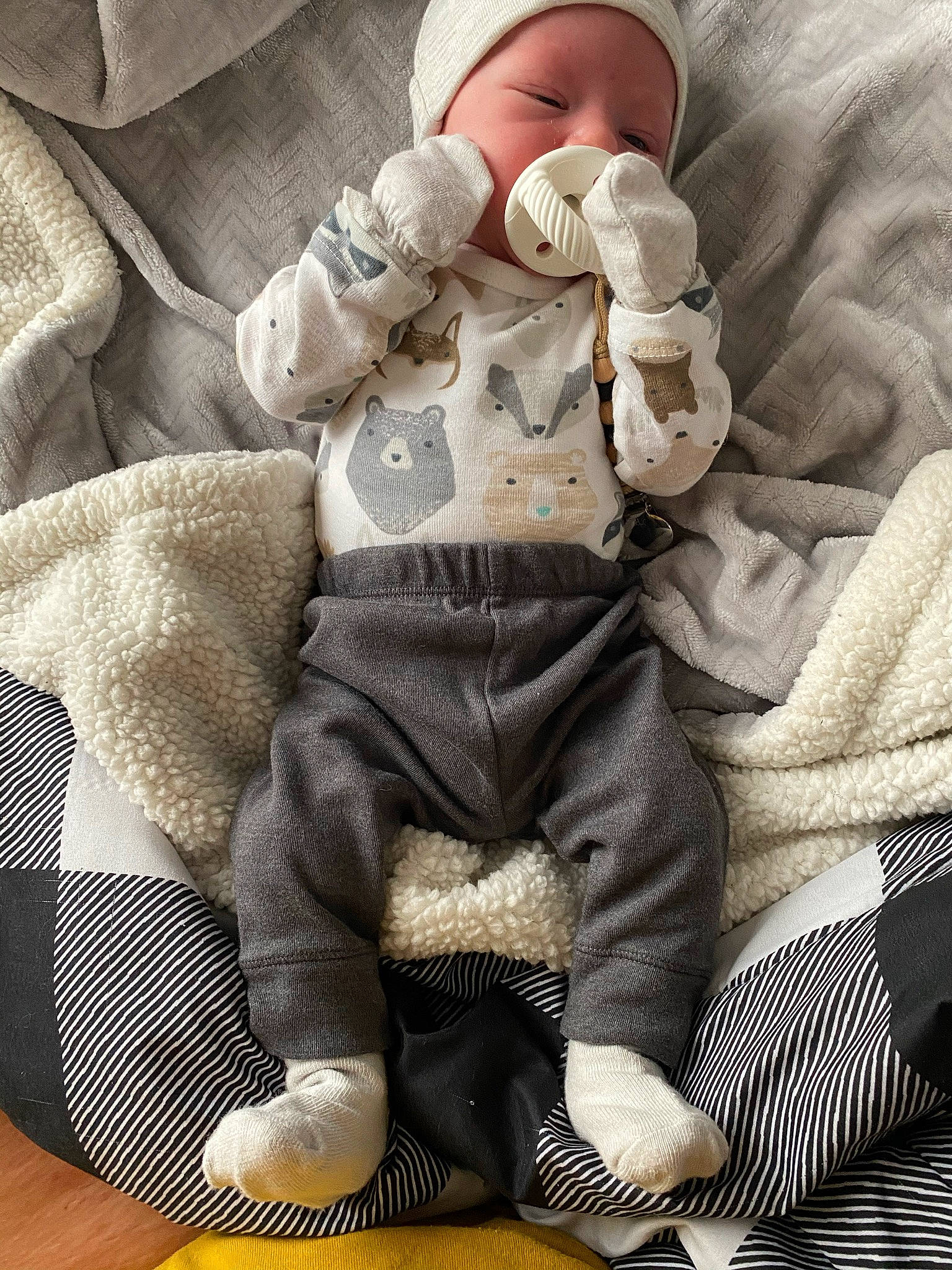 Zayland joined the competition — help win amazing prizes! baby, baby_sleeping, baby_toddler_clothing, child, comfort, doll, glasses, human_leg, knee, lap, linens, pattern, person, sitting, sleeve, stuffed_toy, textile, thigh, toddler, toy