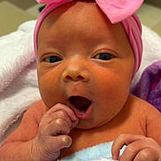 Eymbir is registered to the contest to win money with this photo: baby, newborn, infant, pink_bow, headband, blanket, wrapped, cute, indoors, hand, face, expression, soft, pastel_colors, skin, child, yawning, portrait, cozy, newborn_baby