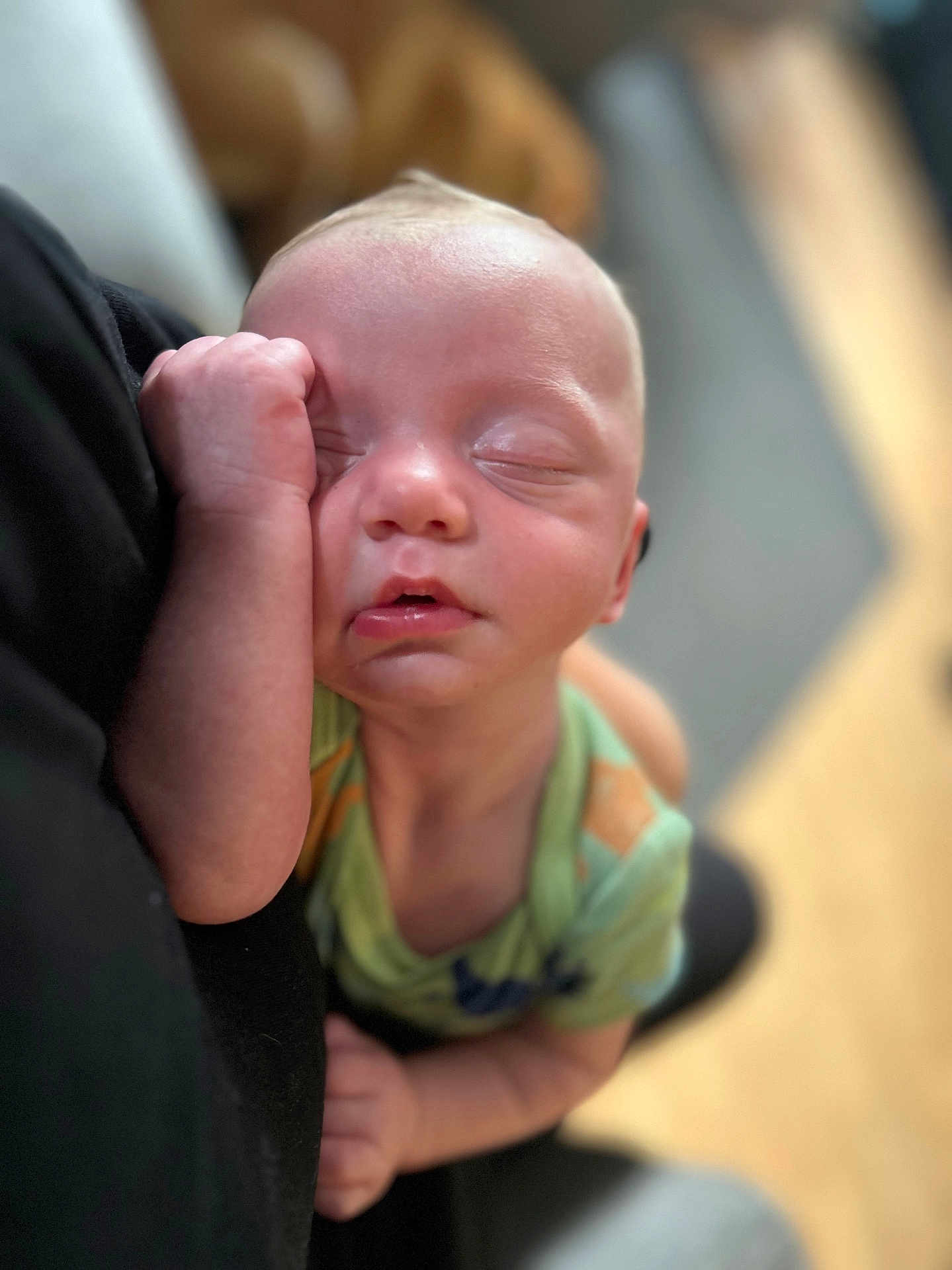 Bentley is registered to the contest to win money with this photo: baby, sleeping, infant, face, hand, cheek, closeup, soft_focus, green_clothing, person, indoors, nap, peaceful, young_child, skin, head, arm, resting, portrait, cute