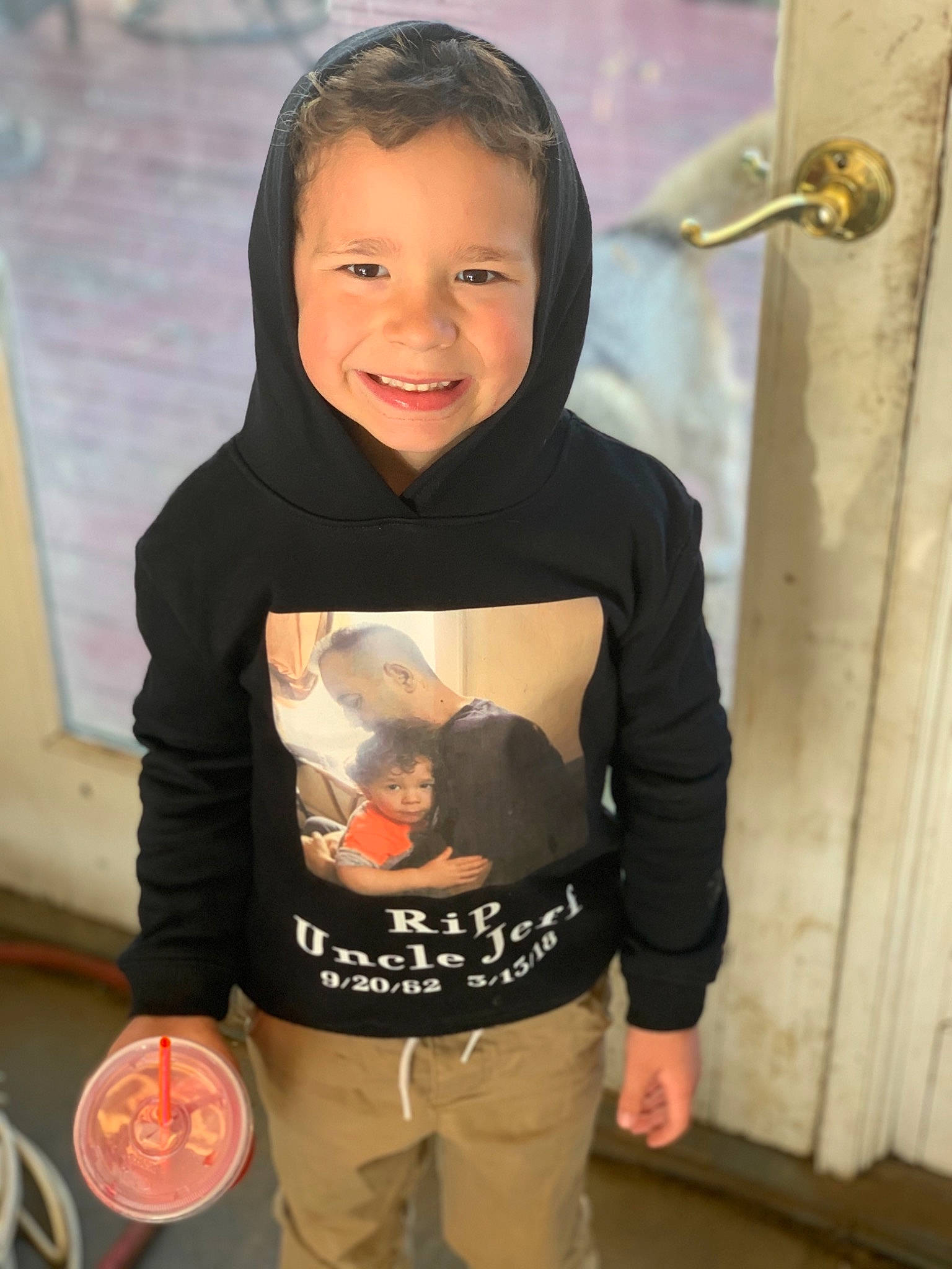 Carter Jon Ponte is registered to the contest to win money with this photo: baby, baby_toddler_clothing, cheek, child, fun, hairstyle, happy, hoodie, joy, laugh, long_sleeved_t_shirt, pattern, person, personal_protective_equipment, product, room, sleeve, smile, standing, t_shirt