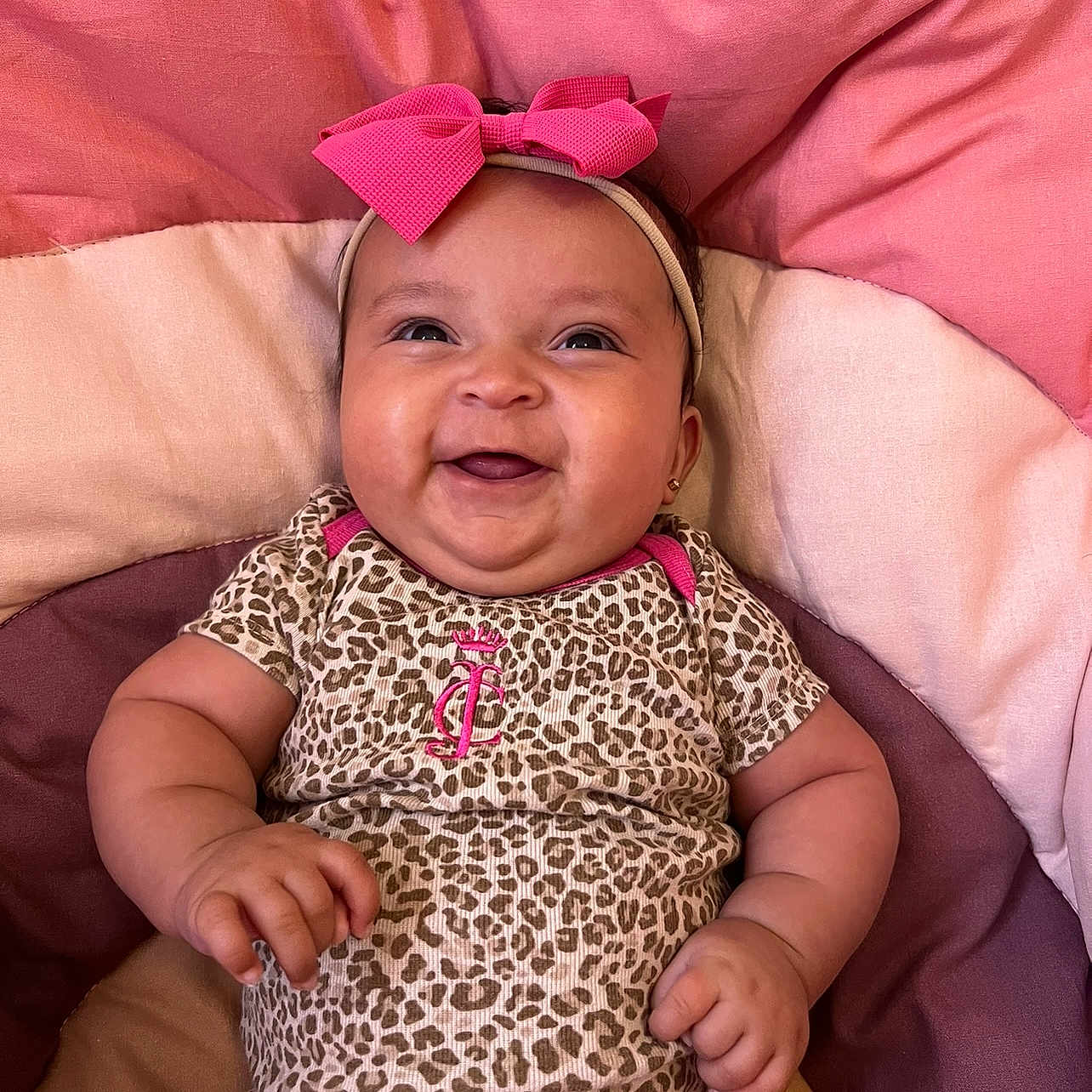 Ivey is registered to the contest to win money with this photo: accessories, baby, babylaughing, bed, clothing, couch, cushion, dress, face, furniture, happy, head, homedecor, indoors, laughing, person, photography, portrait, smile, t_shirt