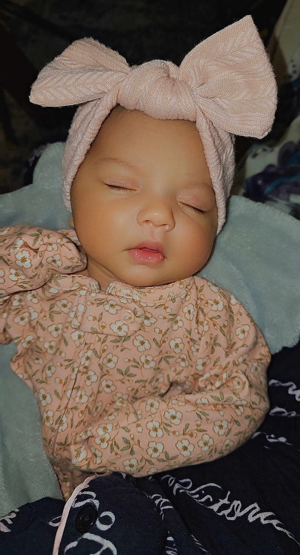Avani joined the competition — help win amazing prizes! baby, sleeping, headband, bow, pink, floral_outfit, blanket, cozy, peaceful, infant, face, closed_eyes, cute, child, soft, rest, portrait, warm, newborn, adorable