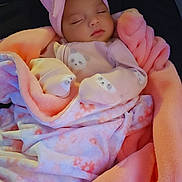 Avani is registered to the contest to win money with this photo: baby, sleeping, blanket, pink, headband, bow, soft, cute, infant, clothing, child, portrait, peaceful, indoors, rest, cozy, wrapped, warm, face, toddler