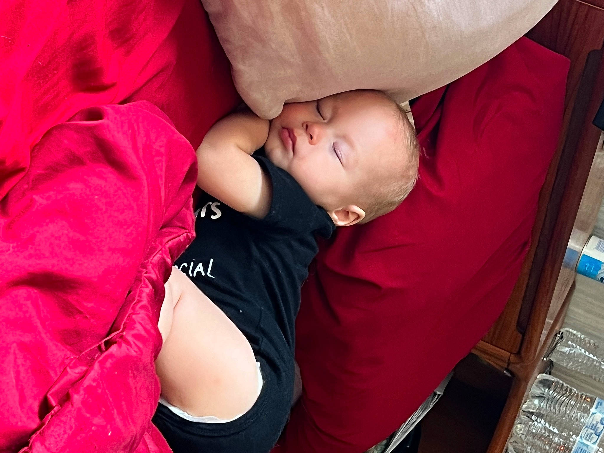 Nicholas is registered to the contest to win money with this photo: baby, baby_products, baby_toddler_clothing, carmine, chair, cheek, child, comfort, couch, fun, happy, magenta, mouth, nap, person, pink, room, sitting, skin, t_shirt