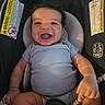 Elijah is registered to the contest to win money with this photo: baby, smiling, infant, car_seat, toy, beads, clothing, cute, happy, child, seat, indoors, person, face, skin, hand, mouth, head, expression, young