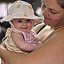 baby, child, woman, mother, smile, hat, bib, holding, portrait, indoor, affection, love, face, skin, arm, closeup, cute, happy, person, family