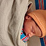 Christian is registered to the contest to win money with this photo: baby, newborn, sleeping, beanie, hat, blanket, swaddle, striped_blanket, infant, close_up, profile, face, cheek, eyelash, peaceful, cozy, hospital, soft_texture, lips, portrait