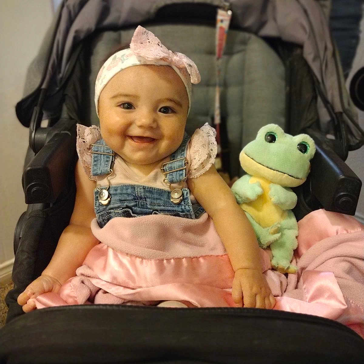 Leylani joined the competition — help win amazing prizes! accessories, baby, cap, city, clothing, dress, face, furniture, happy, hat, head, pants, person, photography, portrait, road, smile, street, stroller, t_shirt