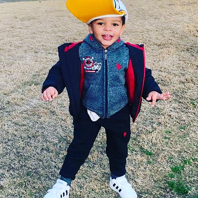 Major is registered to the contest to win money with this photo: cap, child, cool, costume, electric_blue, eye, face, fashion_accessory, fun, grass, happy, head, headgear, headwear, pattern, person, personal_protective_equipment, photograph, recreation, sleeve