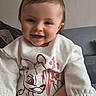 Loélye a rejoint le concours — aidez-le/la à gagner de superbes lots ! toddler, child, smiling, sweater, deer_illustration, indoor, couch, person, happy, baby, portrait, clothing, hand, seated, cozy, casual, cute, face, young_child, home