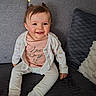 baby, child, smiling, sitting, couch, cardigan, shirt, text, happy, indoor, homedecor, pillow, plush, cute, person, face, hair, infant, clothing, toddler