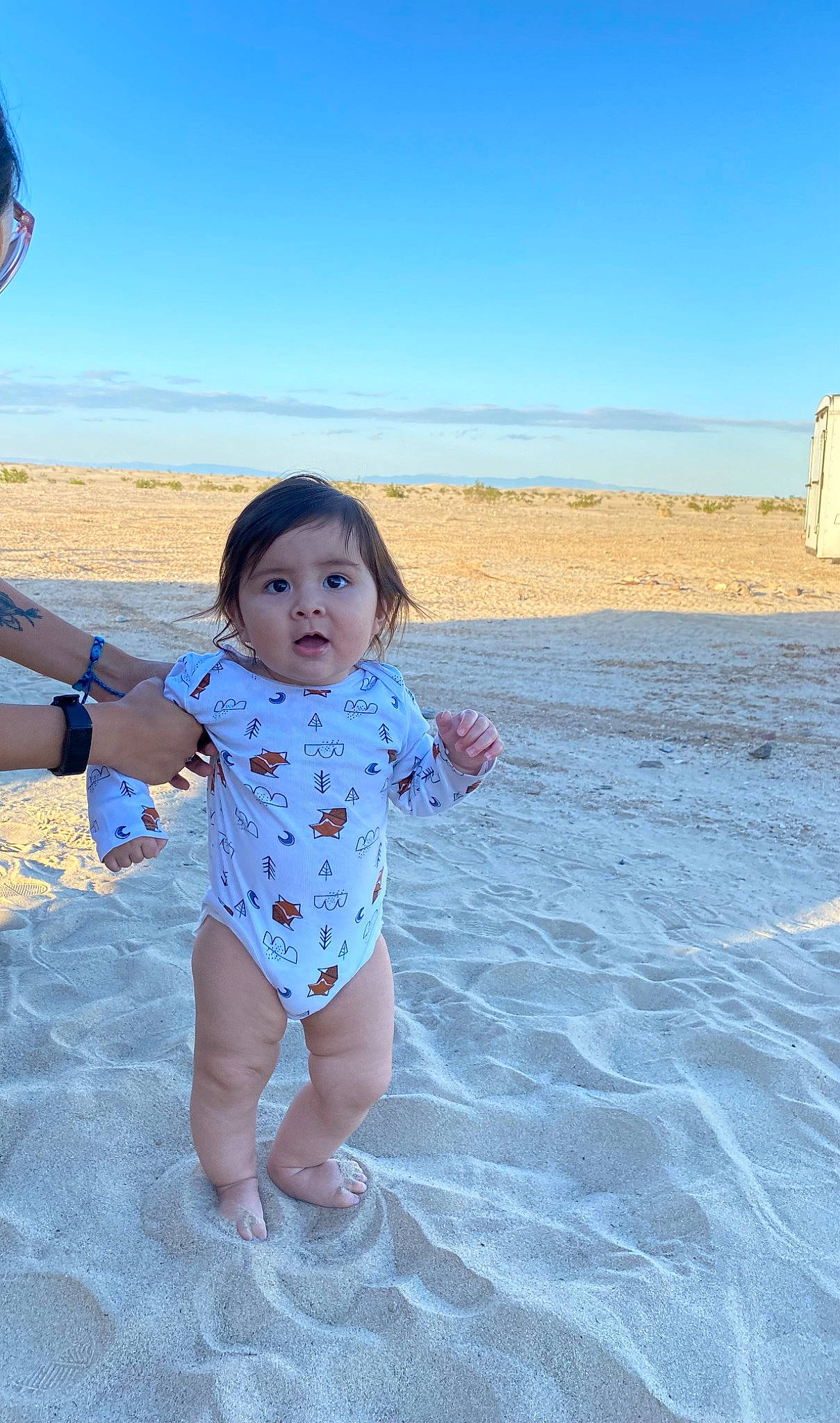 Braiden is registered to the contest to win money with this photo: azure, baby_toddler_clothing, beach, body_of_water, coast, ecoregion, electric_blue, fun, happy, horizon, landscape, leisure, natural_environment, people_in_nature, person, sand, shore, sky, sleeve, surprise