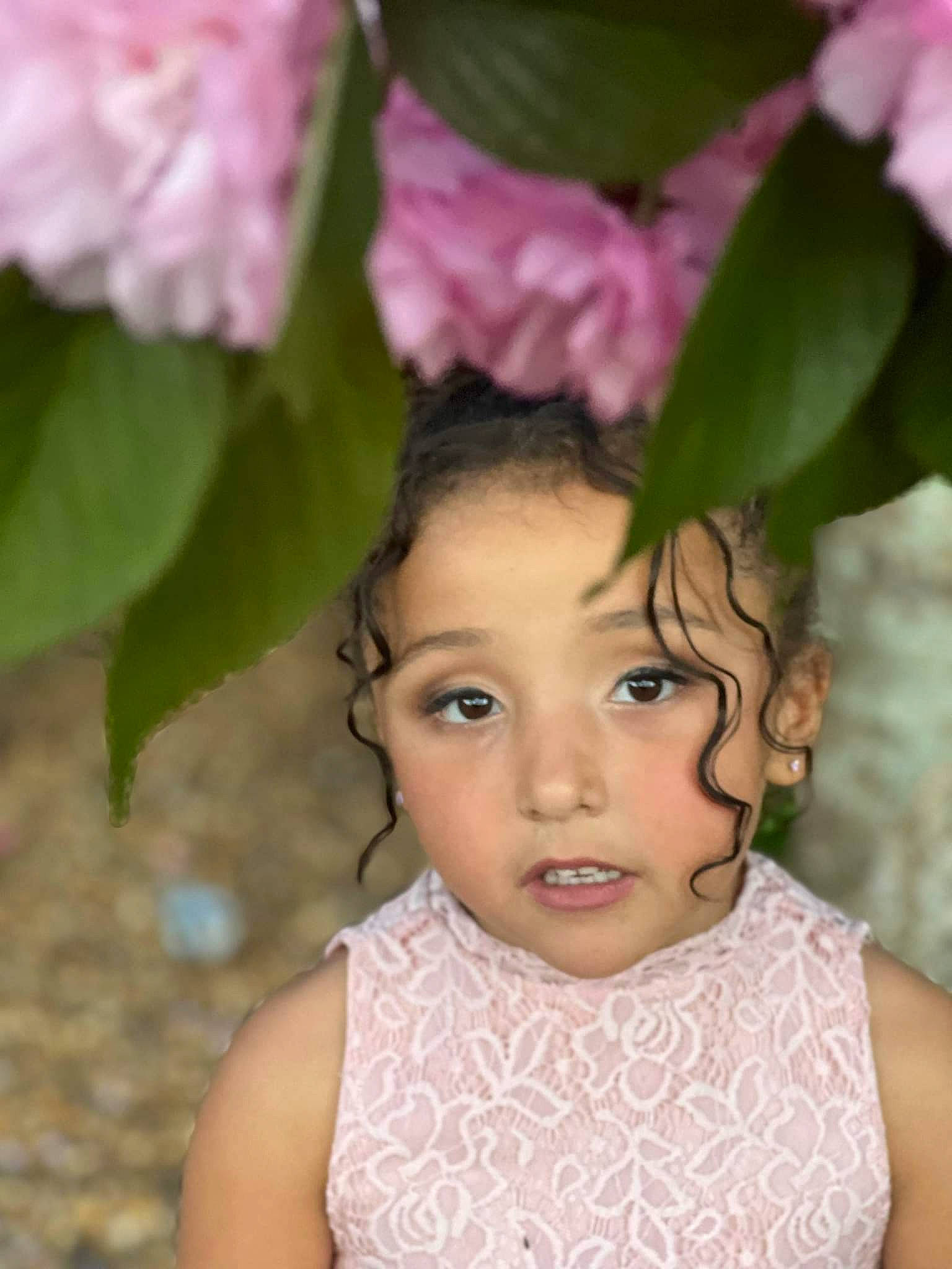 Abigail is registered to the contest to win money with this photo: black_hair, child, chin, eye, eyelash, flash_photography, flower, flowering_plant, happy, head, headgear, headpiece, iris, lip, magenta, person, petal, pink, plant, skin