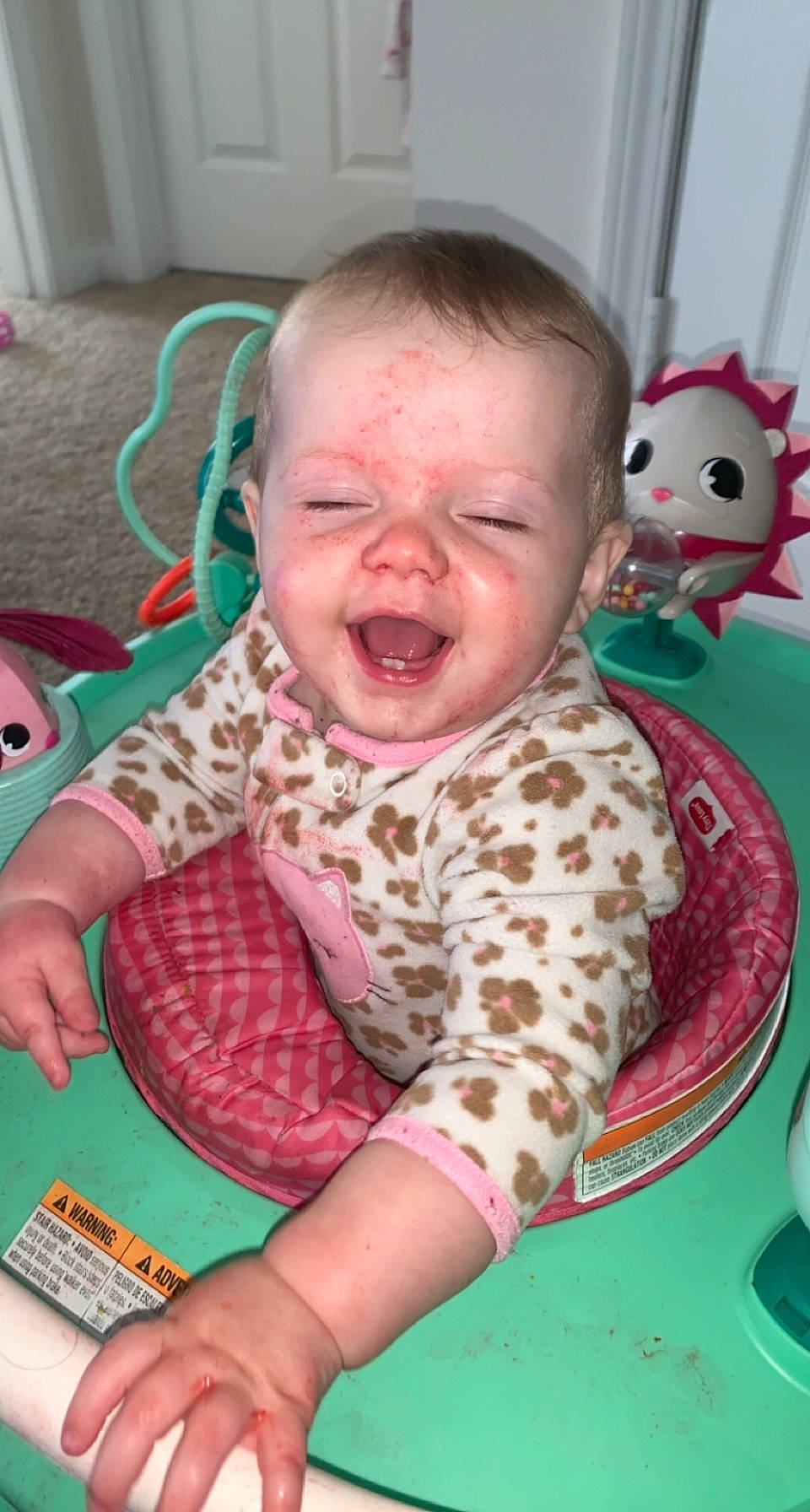 River is registered to the contest to win money with this photo: baby, baby_products, baby_toddler_clothing, baby_toys, cheek, child, finger, fun, green, happy, mouth, nose, organ, person, pink, play, room, skin, smile, toddler