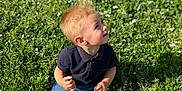 Djeïdon participe au concours pour gagner de l'argent avec cette photo : boy, child, clothing, face, footwear, grass, head, jeans, lawn, male, nature, outdoors, pants, park, person, photography, plant, portrait, shoe, sitting