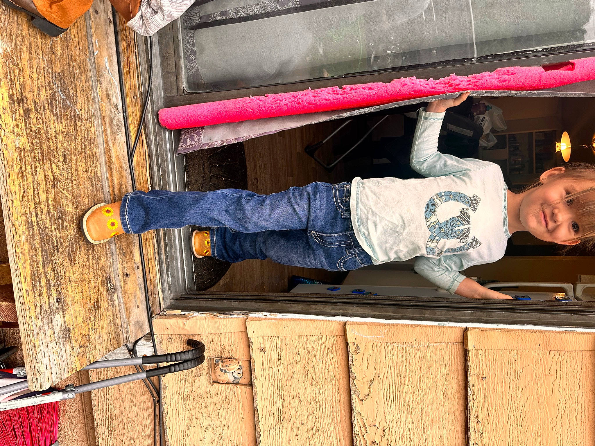 Amalea is registered to the contest to win money with this photo: bus, denim, hardwood, hat, human_leg, joy, leg, outdoor_shoe, person, sandal, shoe, sneakers, t_shirt, toddler, walking_shoe, wood, wood_stain