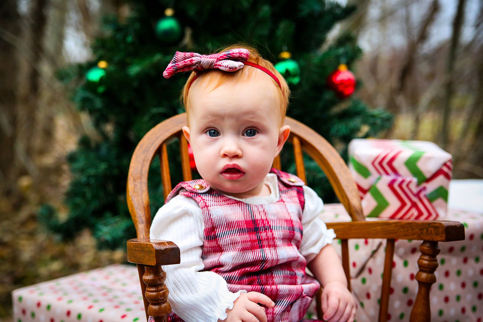 Addalyn joined the competition — help win amazing prizes! baby, baby_toddler_clothing, chair, child, christmas_decoration, christmas_ornament, christmas_tree, event, eye, facial_expression, grass, green, happy, head, holiday, person, plant, shortstraw_pine, sitting, surprise